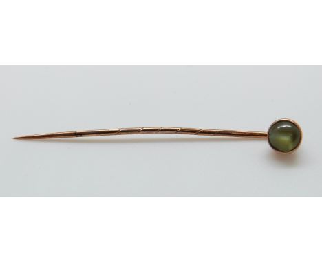 A Victorian stick pin set with a chrysoberyl cat's eye cabochon, 5.5cm, cabochon 0.7cm