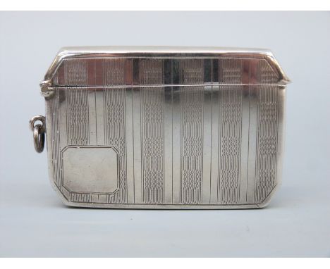 A double sized Art Deco hallmarked silver engine turned vesta with canted corners, vacant cartouche and suspension ring, Birm