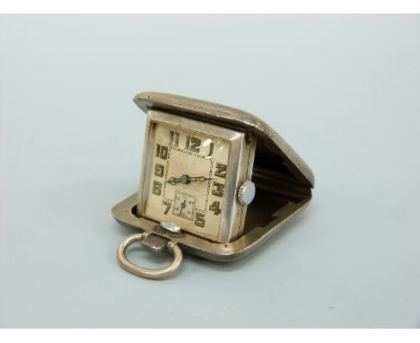 A George V hallmarked silver travelling or fold out clock with suspension loop, Birmingham 1929 maker's mark SSM, 3.6 x 3.6cm