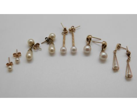 Four 9ct gold and pearl earnings  