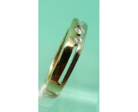 A 9ct gold bi-coloured ring set with three diamonds, 2.72g (size L)