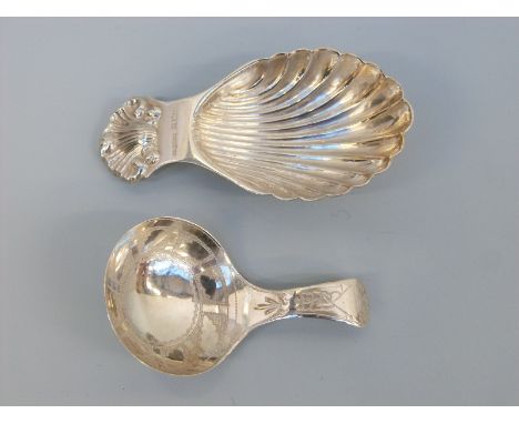 A hallmarked caddy spoon of shell form, Birmingham maker A Maston & Co, together with another, probably Victorian with bright