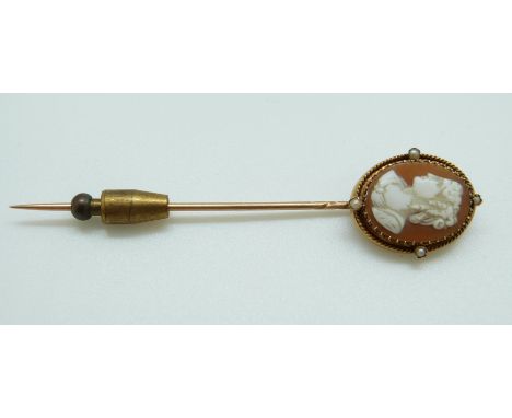 A Victorian stick pin set with an oval cameo and seed pearls to the rope twist border, length 7.5cm