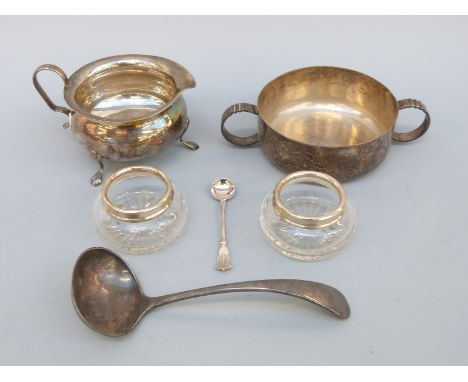 A pair of cut glass hallmarked silver mounted salts, plated two handled bowl, jug, ladle etc