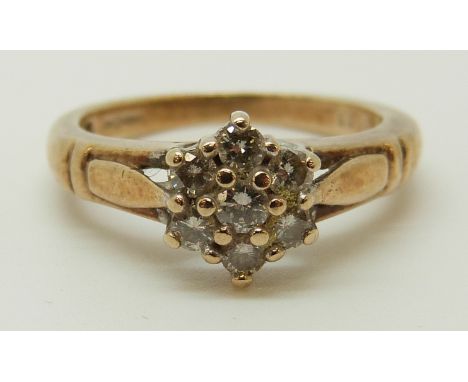 A 9ct gold ring set with diamonds in a cluster, total diamond weight approximately 0.33ct, 3.39g (size J) 