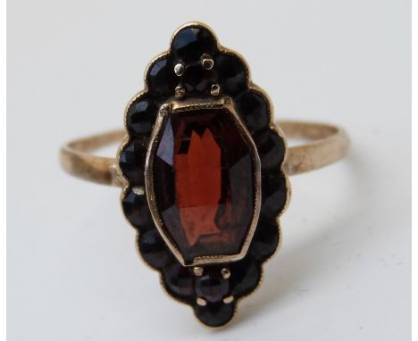 A 9ct gold Victorian ring set with a garnets (size K) 