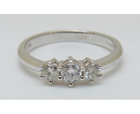 An 18ct white gold ring set with three diamonds, total diamond weight 0.5ct (Size Q)