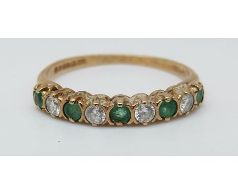 A 9ct gold ring set with emeralds and cubic zirconia (size K) 