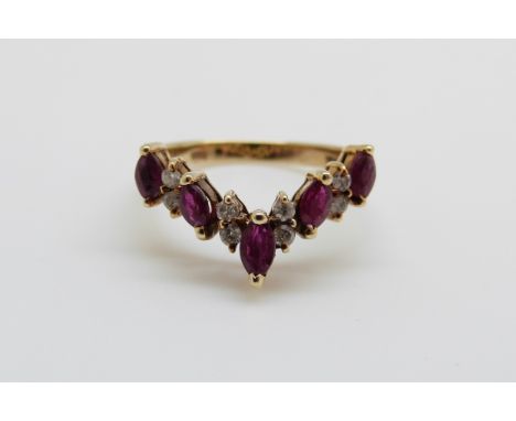 A 14ct gold ring set with diamonds and rubies in a V shape, 3.2g, size K/L