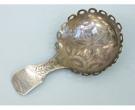 A Georgian hallmarked silver caddy spoon with unusual looped rim, Birmingham 1825 maker Joseph Taylor, length 7.5cm 