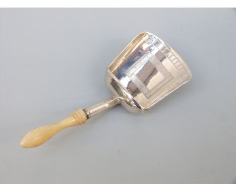 A Georgian hallmarked silver tea caddy spoon of scoop form with turned ivory handle Birmingham 1807, maker's mark IT, length 