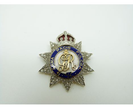 A British Army Honourable Artillery Company gold and platinum brooch set with diamonds and with red and blue enamel reading '