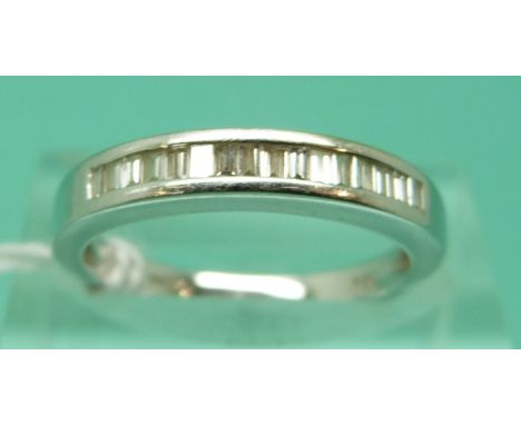 An 18ct white gold ring set with baguette cut diamonds, total diamond weight approximately 0.25ct, 3.1g (size L)