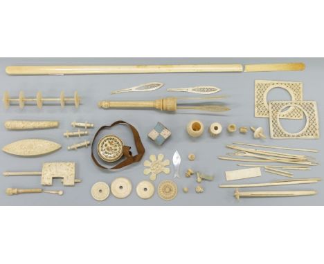 A collection of 19thC ivory and bone items including a Chinese carved ivory bobbin or sewing clamp, fly whisk, page turner, i