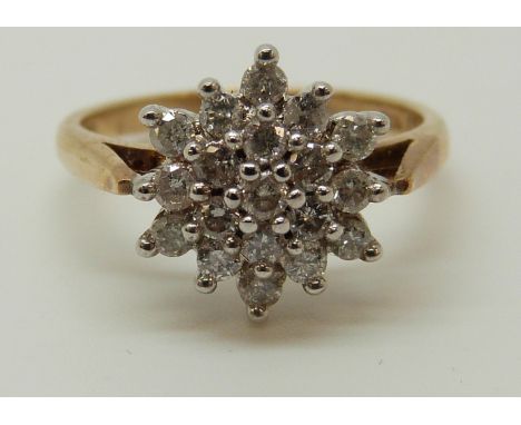 A 9ct gold ring set with diamonds in a cluster, total diamond weight approximately 0.5ct, 2.74g (size K) 