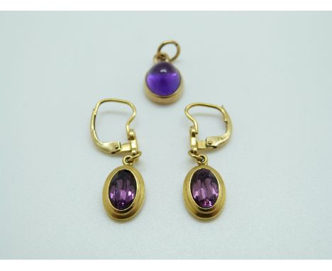 A 9ct gold pendant and earrings set with amethyst