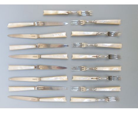 A set of eight hallmarked silver cake knives and forks with mother of pearl handles (eight knives and nine forks) Sheffield 1