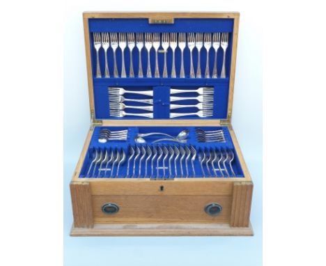 A George V 12 place setting oak cased canteen of hallmarked silver cutlery in the King James or similar pattern, comprising 2