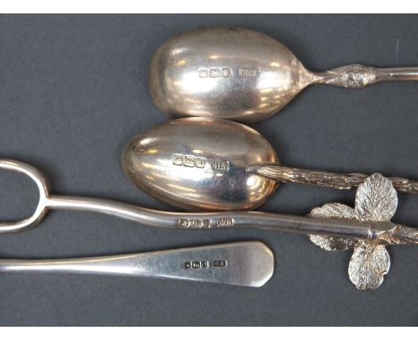 Three various Victorian and later hallmarked silver teaspoons including a twig handled example and a pickle fork with leaf fi