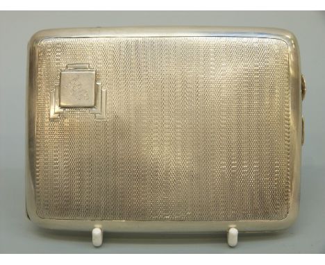 An Art Deco engine turned curved hallmarked silver cigarette case, Birmingham 1935, weight 145g