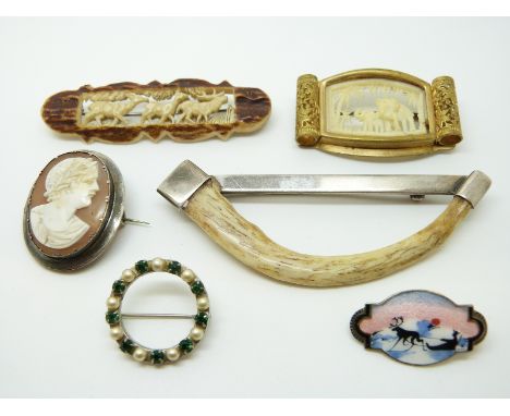 A Norway silver and enamel brooch, bone brooches one with silver setting etc