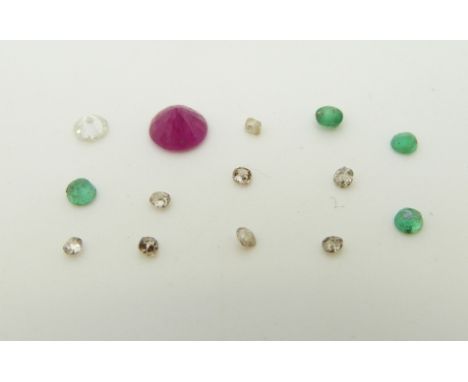 Four emeralds, a round cut diamond and a round cut ruby 