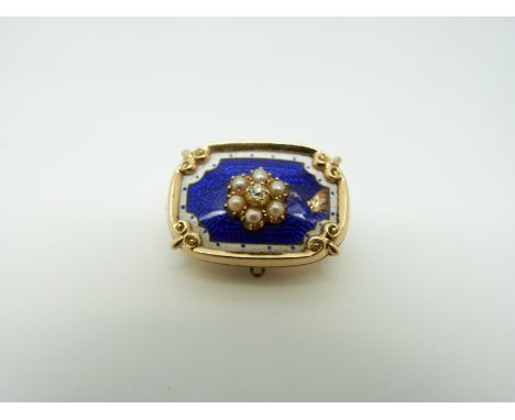 A Victorian brooch, the blue guilloché enamel ground set with seed pearls in a flower cluster with a diamond to the centre wi