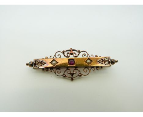 A Victorian 15ct gold brooch set with a ruby and two seed pearls, 4.5cm 