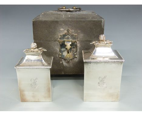 A pair of George III hallmarked silver tea caddies with flower finials in original two division shagreen caddy with velvet li