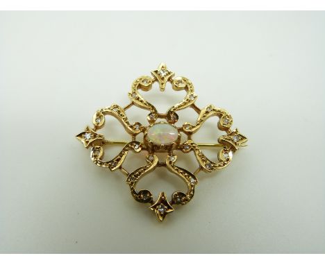 An 18ct gold brooch set with an opal cabochon to the centre surrounded by diamonds, 3.3cm 