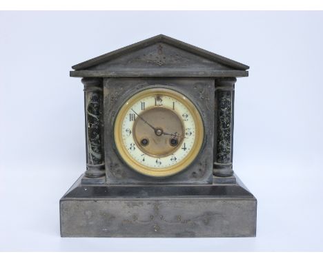 A late 19thC French slate and marble mantel clock, the ivory coloured Arabic chapter ring with gilt surround and beetle and p