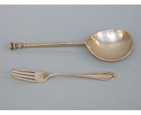 A George V hallmarked silver seal top spoon, London 1930 maker William Comyns & Sons Ltd, length 17cm and a hallmarked silver