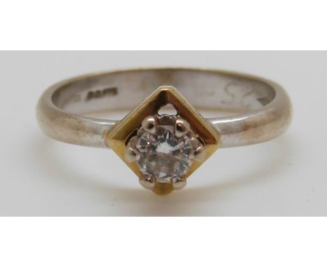 An 18ct white gold ring set with a round brilliant cut diamond of approximately 0.25ct in a square setting, 3.7g (size M)