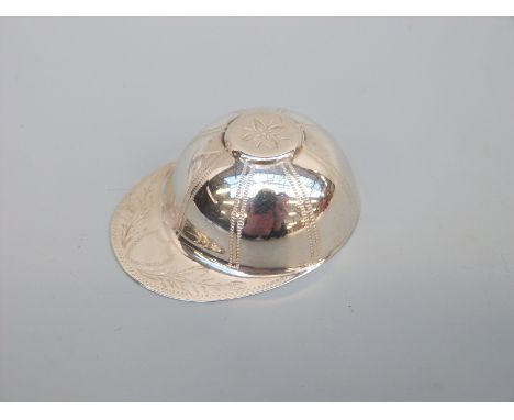A hallmarked silver tea caddy spoon in the form of a jockey's cap, London 1982 maker's mark DSS, length 5cm