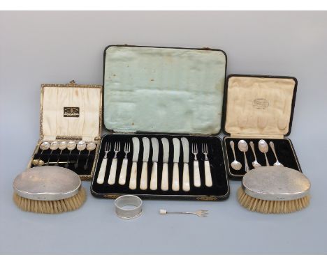 A cased set of six hallmarked silver coffee bean spoons, five further hallmarked silver teaspoons, a silver napkin ring and a