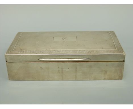 A George V hallmarked silver cigarette box with engine turned lid, Birmingham 1929 maker D Bros, length 18cm