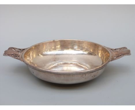 A hallmarked silver shallow porringer with pierced handles, London 1922 first part of maker's mark rubbed, width 17.5cm, weig