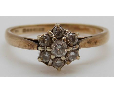 A 9ct gold ring set with diamonds in a cluster (size L)
