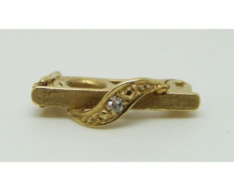 A 14ct gold pearl clip set with a diamond in original Garrard box 