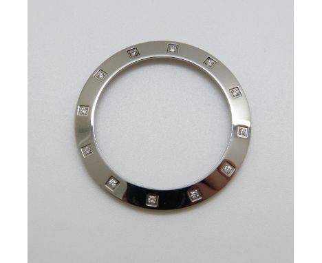 A white metal pendant/ watch bezel set with diamonds, 6.9g, 4 x 4cm