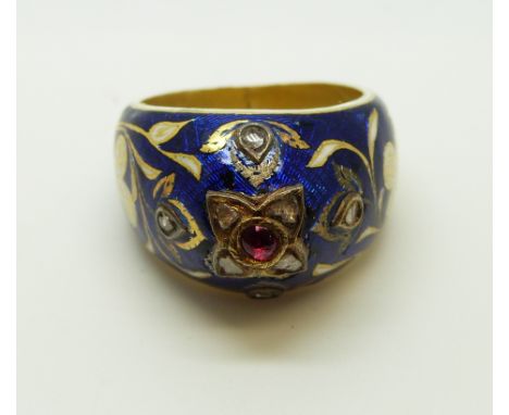 A Georgian ring, the blue enamel ground with white enamel flowers and shamrocks with gilt highlights and set with further poi