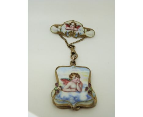 An Art Nouveau brooch set with enamel depicting cherubs with a drop section opening to reveal a mirror with similar decoratio
