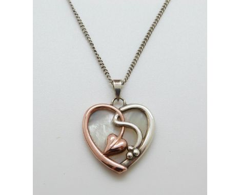 A 9ct gold and silver Clogau pendant in the shape of a heart set with mother of pearl 