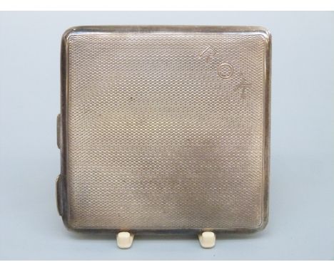 A George VI Mappin & Webb hallmarked silver engine turned powder compact, width 6.5cm, weight 77g all in 