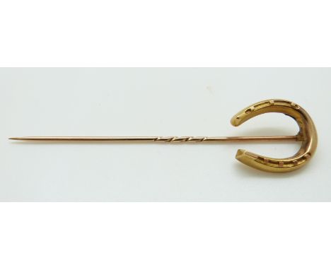 An Edwardian 15ct gold stick pin in the form of a horseshoe, 8.5cm, 3.7g