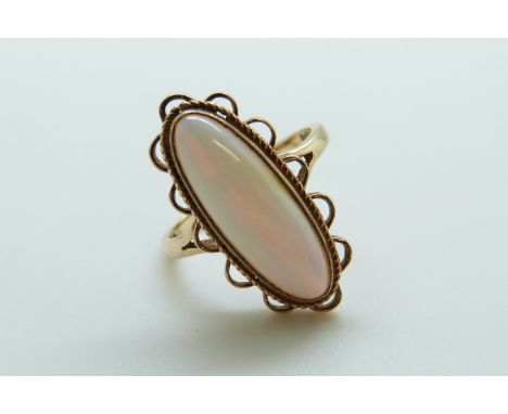 A 9ct gold ring set with an opal cabochon (size P)