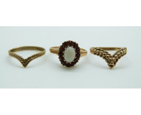 Three 9ct gold rings, one set with an opal surrounded by garnets, 4.6g