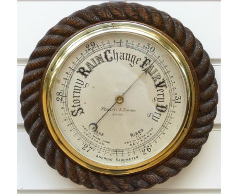 Negretti & Zambra of London barometer in oak rope twist surround, 30cm overall diameter