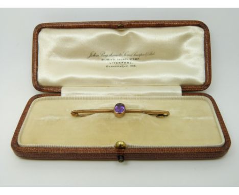A 9ct gold brooch set with an amethyst, in original box 