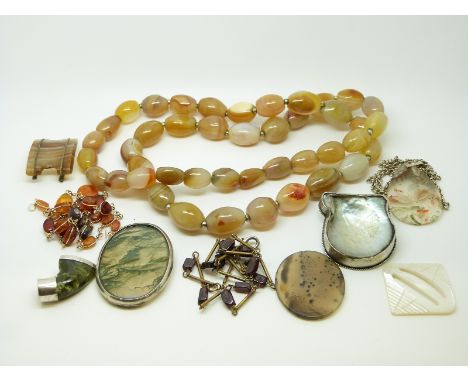 A yellow metal and amber necklace, agate beaded necklace, a necklace set with garnet beads, moss agate brooch, agate pendant,